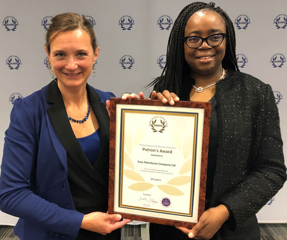Image Ellen de Man and Dr Sade Adenekan receive the award on
behalf of Esso Petroleum Company, Limited